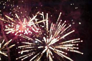 On a black background bokeh from explosions of colorful fireworks. photo