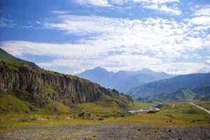 Mountain landscape. Beautiful mountains and meadows, winding river. photo