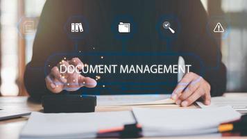 business accounting documents ,auditor ,management and auditing of office documents ,Reports for Tax Time Analysis ,office worker working with document folder ,Management of corporate data storage photo