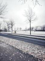 Mailman delivering posts during Winter photo