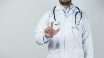 male doctor is holding stethoscope into the camera photo