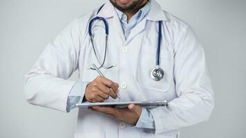 male doctor is holding stethoscope into the camera photo