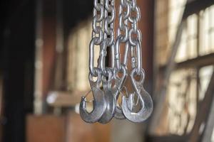 Metal chains with hooks in the workshop of a metallurgical plant. photo