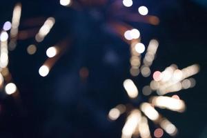 On a black background bokeh from explosions of colorful fireworks. photo
