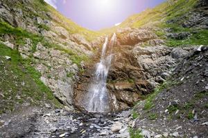 Beautiful waterfall on the mountain with blue sky Waterfall in tropical highlands. photo