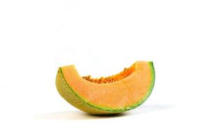 slice of japanese melons, orange melon or cantaloupe melon with seeds isolated photo