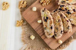 Top view of biscotti on wood plate, home made bakery and healthy food photo