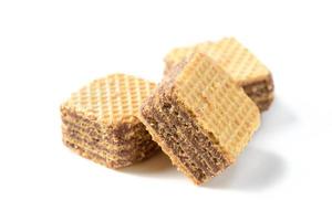 square chocolate wafer biscuits isolated on white background, bakery and snack photo