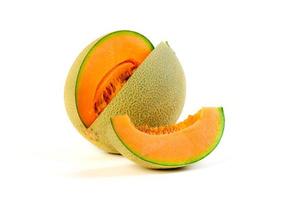 whole and slice of japanese melons, orange melon or cantaloupe melon with seeds isolated on white photo
