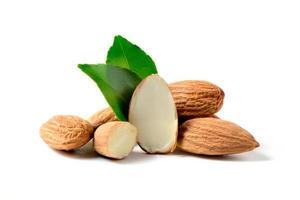 Almonds nut with leaves isolated on white background. They are highly nutritious and rich in healthy fats photo