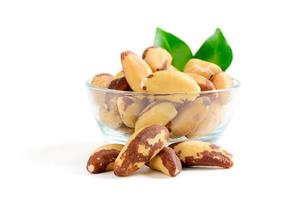 Brazil nuts isolated on white wooden background,  healthy food photo