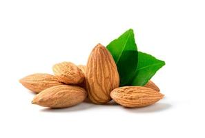 Almonds nut with leaves isolated on white background. They are highly nutritious and rich in healthy fats photo