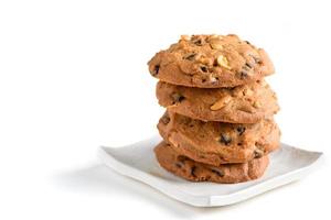 Homemade pastry cookies on white dish isolated on white background, photo