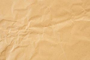Abstract brown crumpled creased recycle paper texture background photo