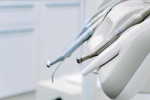 Modern dental equipment in dentist clinic. Dentists tools for treatment and surgery of teeth. photo