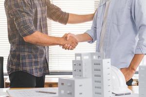 Success deal, Meeting and greeting for project of partner. Construction engineering, architect worker team or partnership hands shaking, handshake after agreement in office site, collaboration concept photo