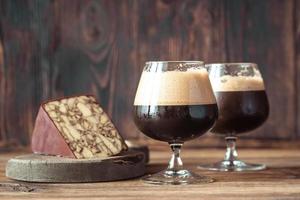 Two glasses of dark beer with Irish Porter Cheddar photo