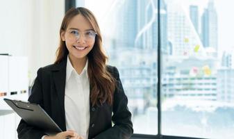 Business woman holding files Inside the modern office. photo