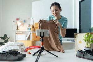 Beautiful young woman working at online store Wearing casual clothes. photo