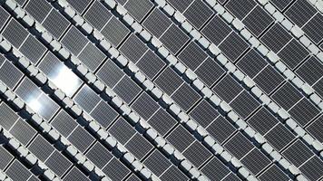 Aerial top view of solar panels or solar cells on buoy floating in lake sea or ocean. video