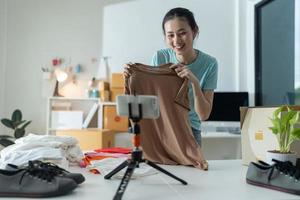 Beautiful young woman working at online store Wearing casual clothes. photo