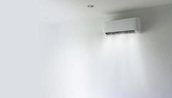 Air conditioner and wind flow on wall background photo