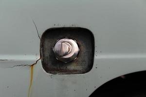 Classic old style fuel cap that requires a key to open from the outside. photo