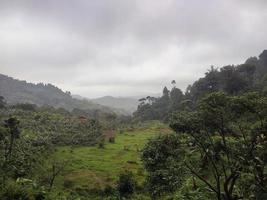 Mountain landscape photo with farmer fields.