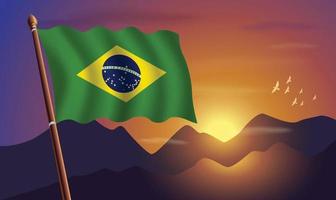 Brazil flag with mountains and sunset in the background vector