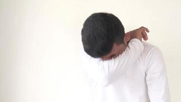 Young ill man covering his nose and mouth with arm video