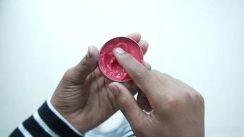 Close up of man hand using petroleum jelly video