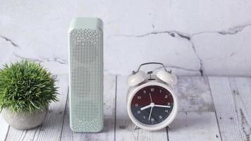 Smart speaker and a alarm clock on table video