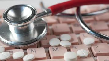 Close up of pills and stethoscope on keyboard video