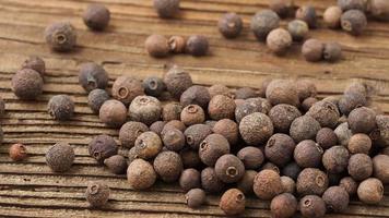 Allspice spice on wooden table video