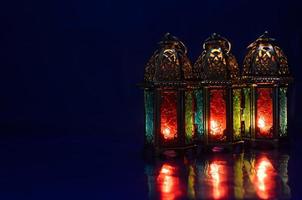 Lanterns put on table with dark blue background for the Muslim feast of the holy month of Ramadan Kareem. photo