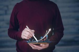 investment ,Analyst working with Business Analytics and Data Management System on smartphone working with graph investment strategy. Corporate strategy for finance, operations, sales, marketing photo