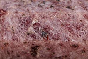 Macro mineral stone Ruby in the breed a white background photo