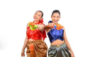 Two beautiful woman in Songkran festival with water gun photo