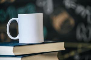 Books and white cup photo