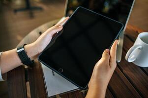 woman hands play tablet on desk photo