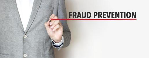 fraud prevention words made with marker and businessman photo