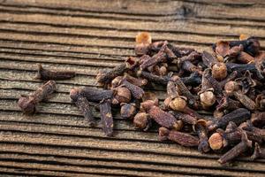 Clove spice on a wooden board, Syzygium aromaticum photo