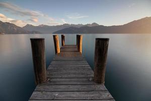 A jetty at a lake photo