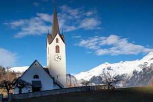 a white chruch in the mountains photo
