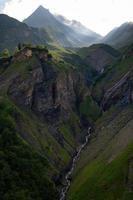 A large waterfall falling down a steep cliff photo