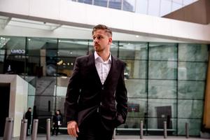 portrait of a young businessman goes to work in a business center photo