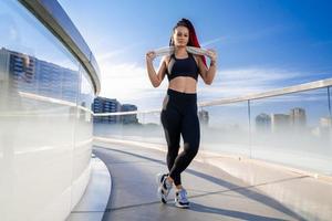 Fitness, portrait of a woman outside for a workout and training for healthy lifestyle and body wellness. Face of sports female or athlete, energy and power photo