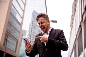 guy in a suit talking on the phone yelling photo