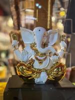 Statue of lord Ganesha white and gold colour photo