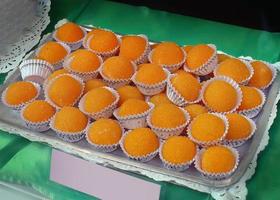 The yolks of St. Theresa or Yemas de Santa Teresa Typical confection Spanish sweets based on egg yolk confit with sugar, pastries, dessert photo